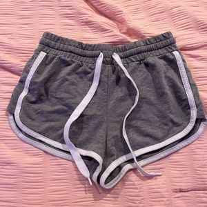 dark gray shorts with white ties